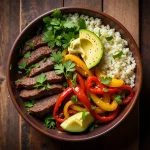 Delicious low-carb steak fajita bowl with vibrant colors.
