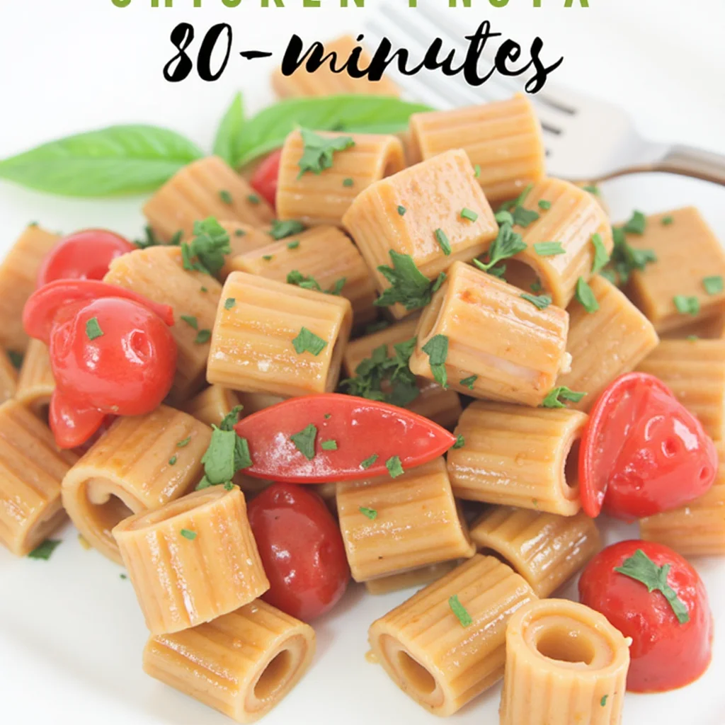 Creamy Chicken Pesto Pasta on a White Plate