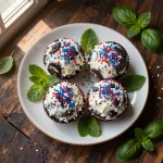 Delicious 4th of July Oreo cream cheese balls decorated with red, white, and blue sprinkles