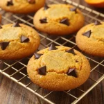A plate of freshly baked pumpkin chip cookies made with just three ingredients.