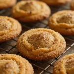 Freshly baked pumpkin snickerdoodle cookies on a wooden table