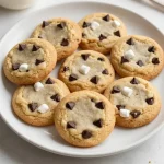 A plate of freshly baked Avalanche Cookies with chocolate chips and white chocolate chunks